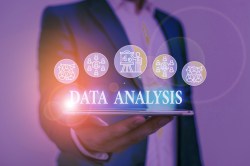 Text sign showing Data Analysis. Conceptual photo Translate numbers to Analytical Conclusion Forecasting Male human wear formal work suit presenting presentation using smart device.